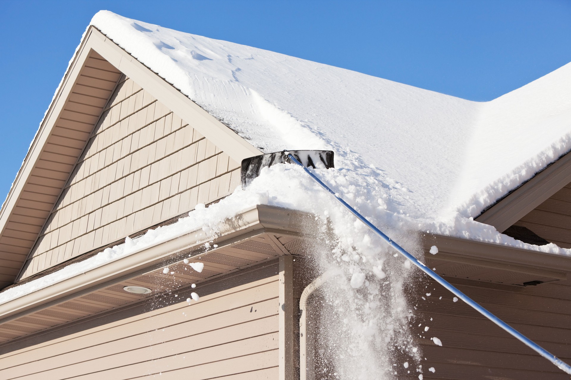 Roofers performing maintenance to ensure a roof in Ogden is ready for seasonal weather changes.